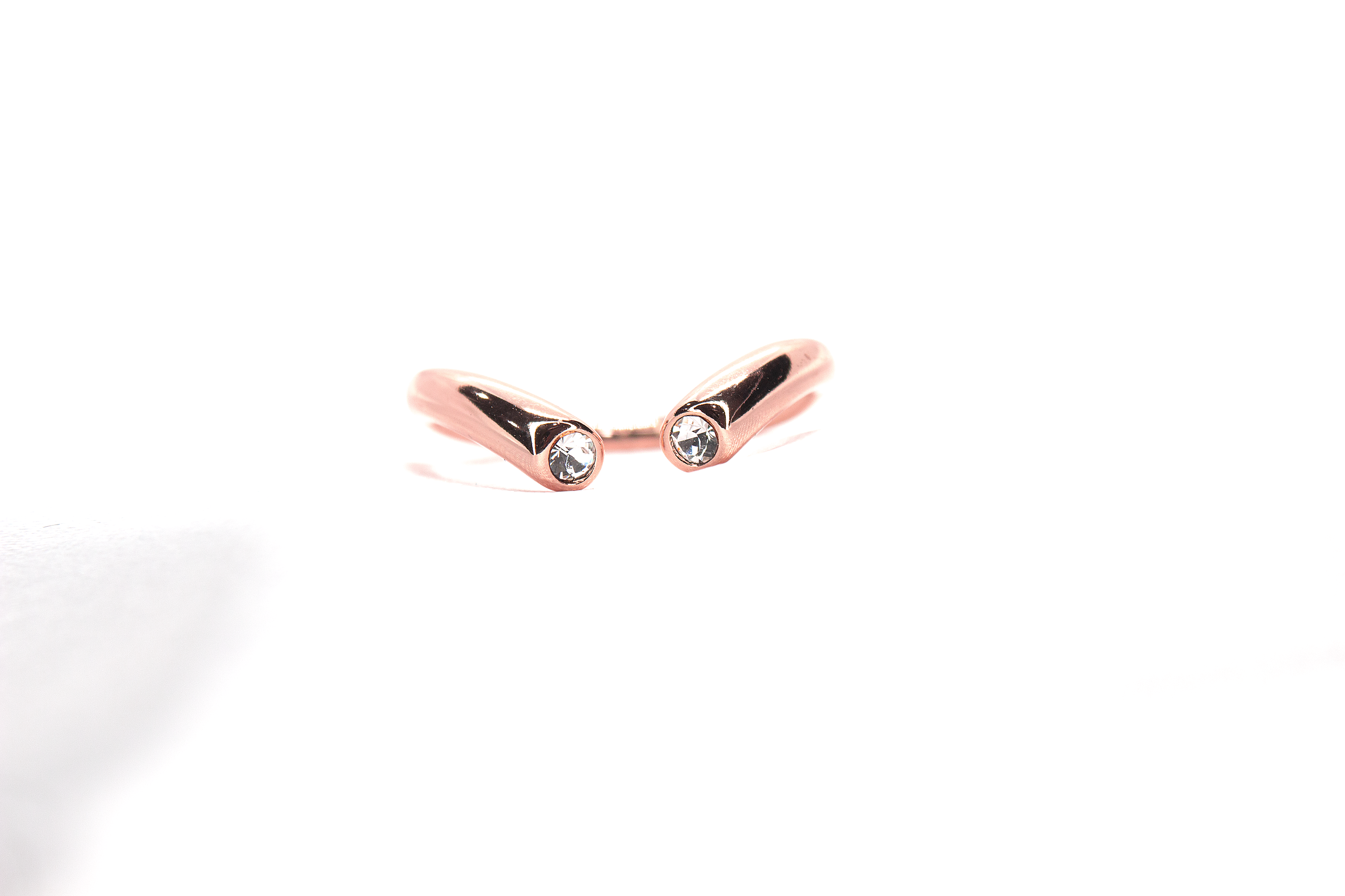 MODERN OPEN-BAND RING WITH BEZEL-SET STONES